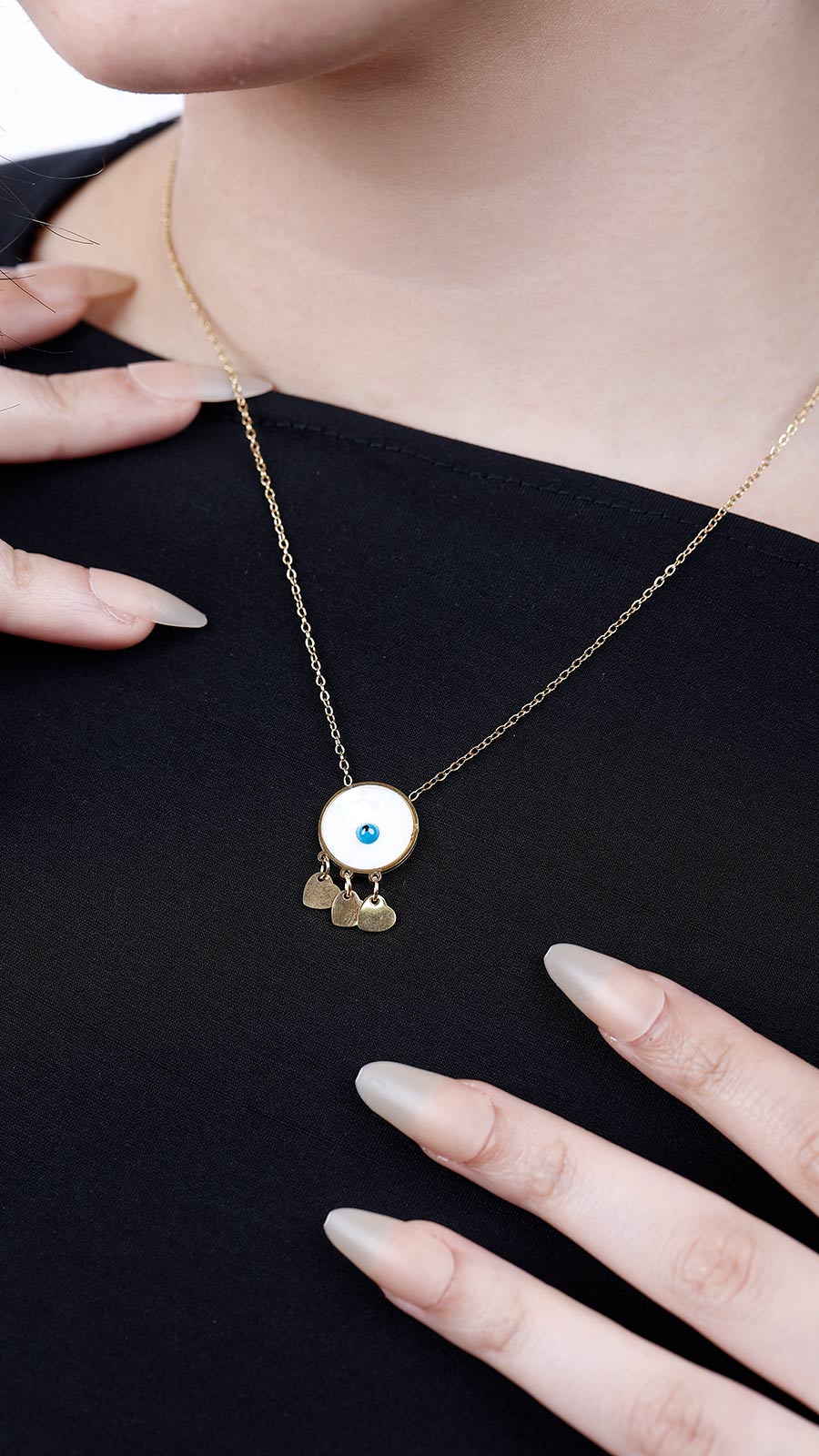 Blue eye and three hearts necklace